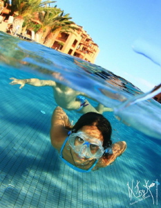 Playing in the swimming pool by Natasha Maksymenko 